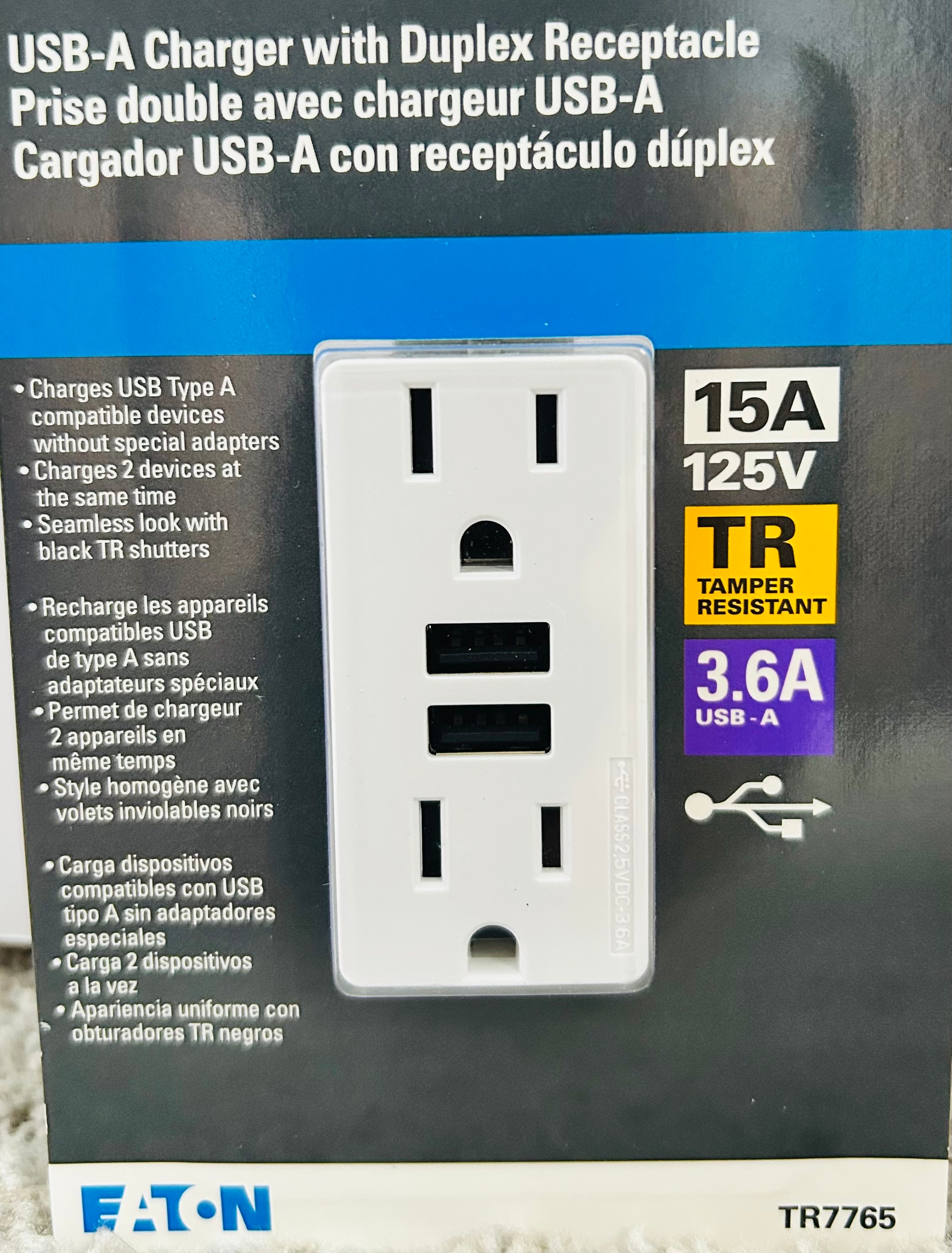 Electrical outlet with USB-A charging port on a branded packaging background