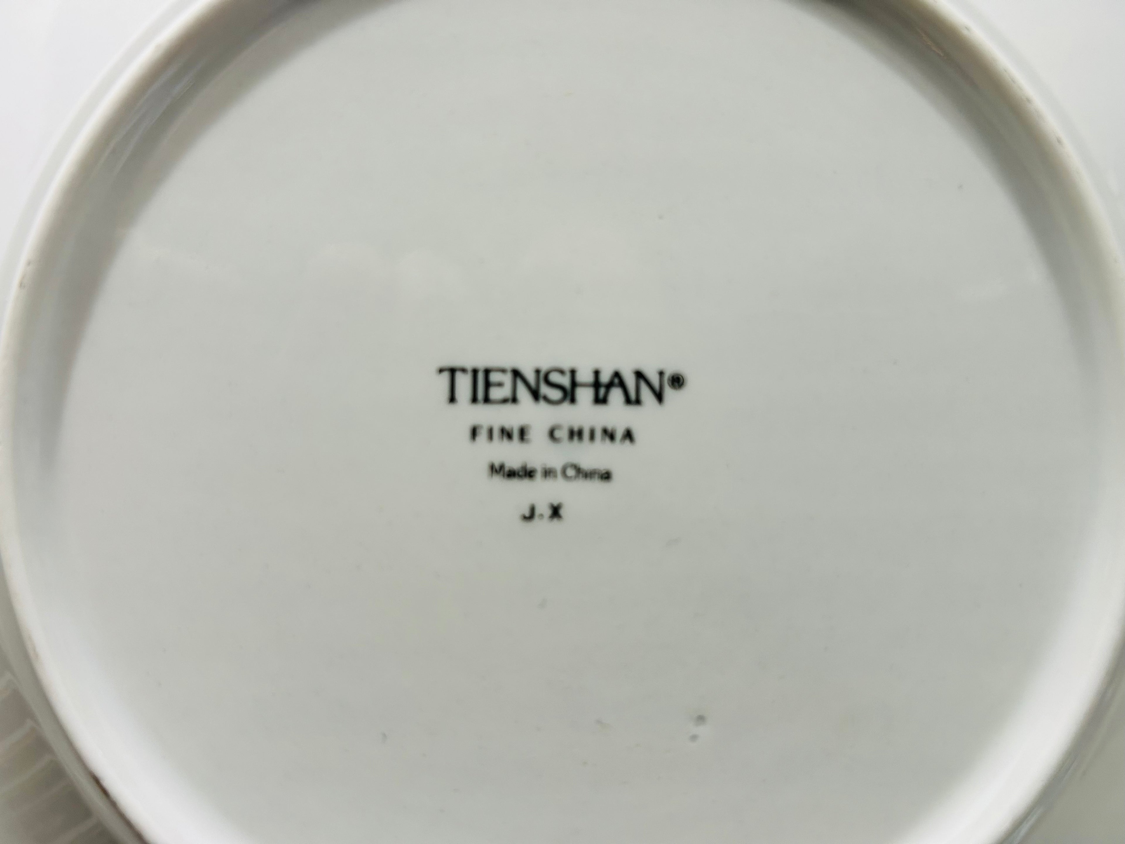 Tienshan Fine China logo on a white plate